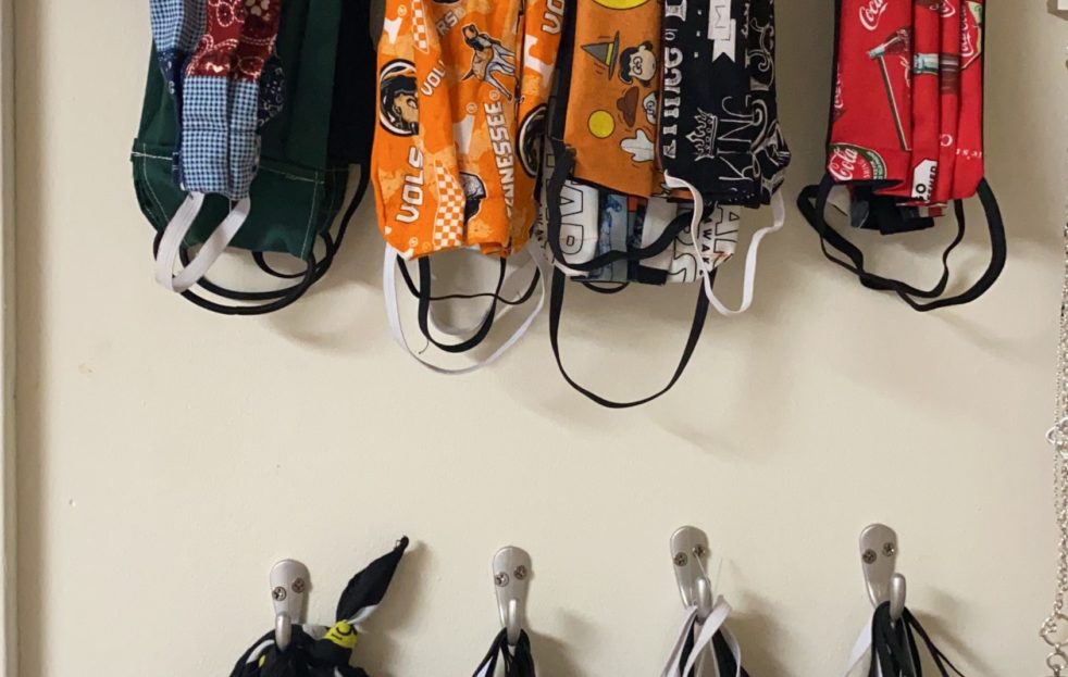 Hanging face masks - Here is how we hand up our face masks using hooks on the wall.