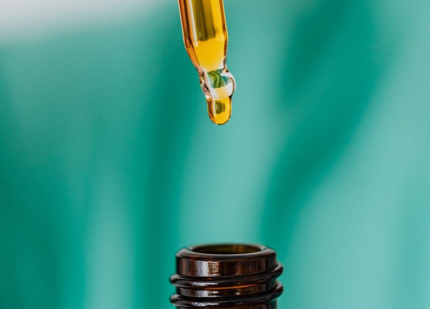 Aromatherapy and Face Masks - You can use essential oils to help with making wearing a face mask more comfortable. brown glass bottle with liquid and pipette Photo by Karolina Grabowska