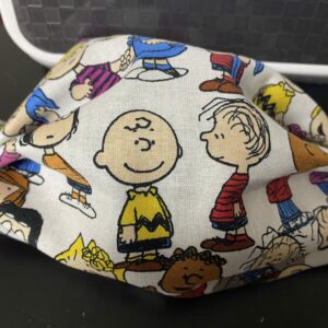 Snoopy and the Peanuts Gang Face Mask a great face mask with a good bit of the Peanuts gang. #Peanuts #Snoopy #CharlieBrown