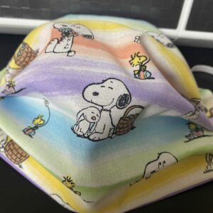 Snoopy & Woodstock Easter Face Mask - An Easter-themed face mask with both Snoopy and Woodstock on it. Along with Easter Eggs and the Easter Bunny. #Snoopy #Woodstock #Easter