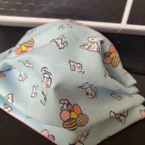 Snoopy Easter Face Mask - An Easter-themed face mask with Snoopy, Easter Eggs and Easter Bunny on it. #Snoopy #Easter