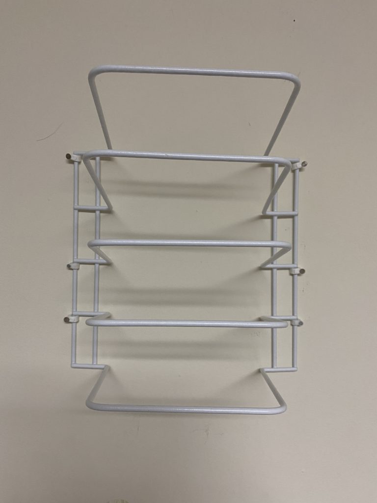 Cheap DIY Wall Vinyl Holder - here is a cheap way to hang up and store your vinyl rolls. #Vinyl #Cricut #DIY