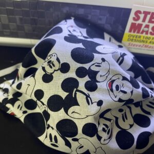 Many Faces of Mickey Face Mask - This face mask has the many faces of Mickey Mouse on it. #Mickey #MickeyMouse