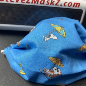 Beach Snoopy Face Mask - Snoopy is chilling on the beach under a beach umbrella. #Snoopy #Beach