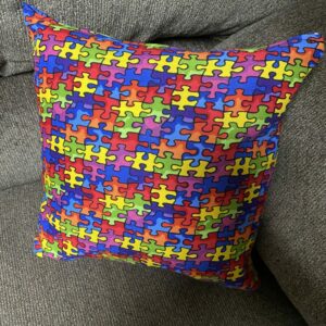 Autism Awareness Decorative Pillow - A decorative pillow with colorful puzzle pieces on it. #Autism #AutismPillow #AutismAwareness