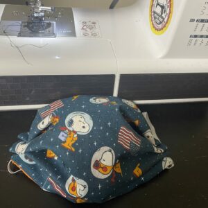 Snoopy in Space Face Mask - This face mask features Snoopy as an Astronaut and in space. #Snoopy #SnoopyinSpace #SnoopyFaceMask