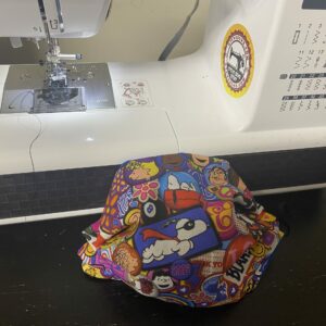 Retro Snoopy Face Mask - a very colorful retro-looking face mask featuring some of the Peanuts Gang. #Snoopy #SnoopyFaceMask