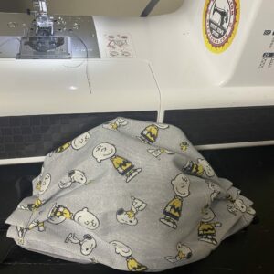 Charlie Brown, Snoopy and Woodstock Face Mask - A Gray, black, yellow and white in color face mask featuring some of the Peanuts gang. #CharlieBrown #Woodstock #Snoopy #SnoopyFaceMask