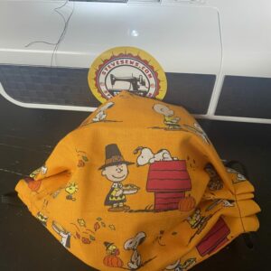 Peanuts Thanksgiving Face Mask - This face mask is great for Thanksgiving and features Charlie Brown, Snoopy and Woodstock. #Thanksgiving #Snoopy #CharlieBrown #Woodstock