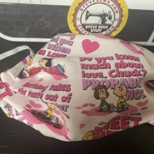 Peanuts Valentine Conversation Face Mask - Here is a Peanuts face mask with Valentine conversations. Featuring Charlie Brown, Linus, Sally, and more. #CharlieBrown #ValentinesDay #SweetBaboo