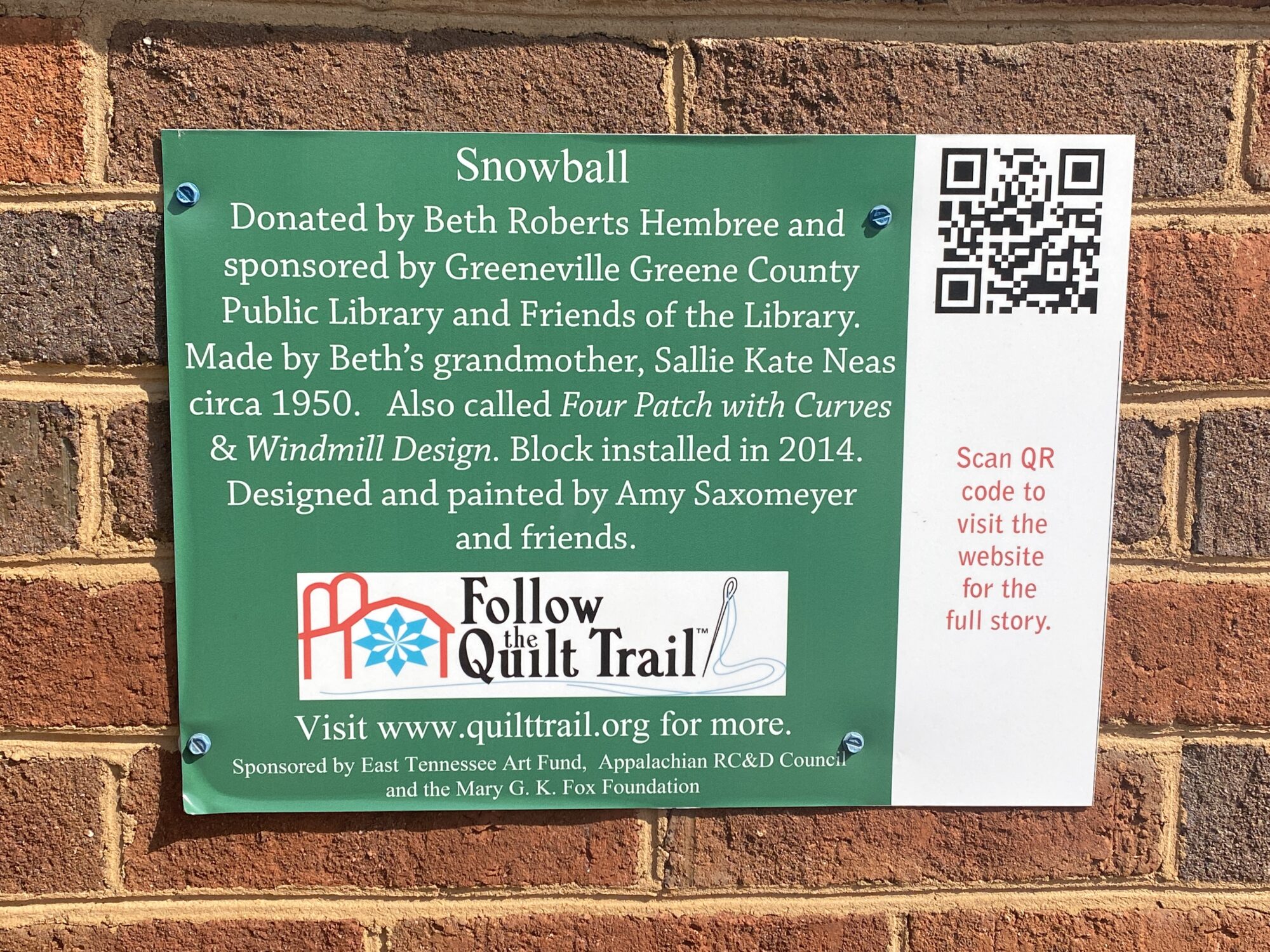 Donated by Beth Robert Hembree and sponsored by Greenville Greene County Public Library and Friends of the Library. Made by Beth's grandmother, Sallie Kate Neas circa 1950. Also called Four Patch with Curves & Windmill Design. Block installed in 2014. Designed and painted by Amy Saxomeyer and friends.