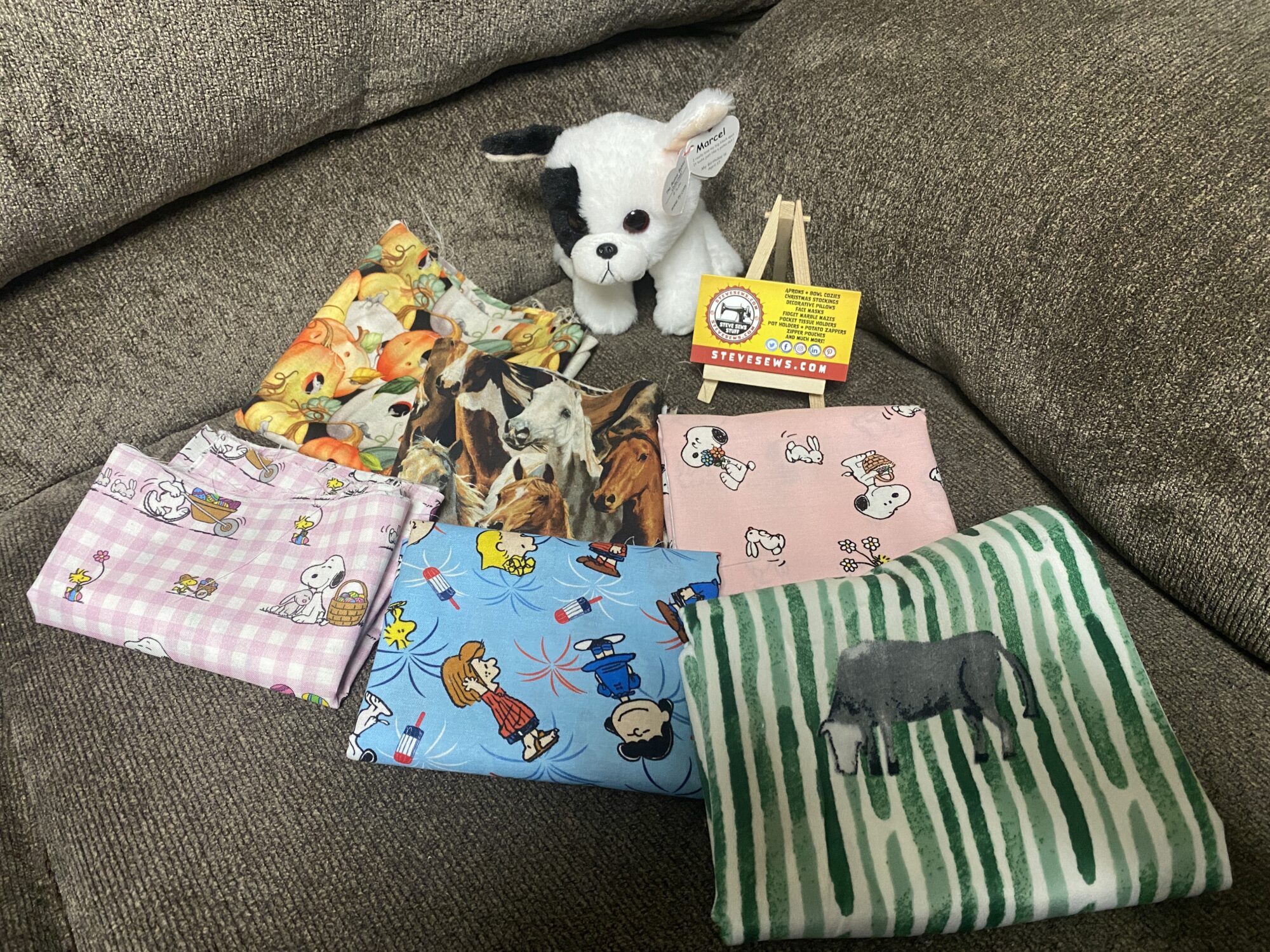 Meet Marcel, he will be our Accommodations Specialist, helping to make sure Steve Sews is making the right accommodations for all of the Lovees to fulfill their job duties. He is also showing off some fabric for future projects and stuff for sale. He shares a birthday with Steve’s daughter, Amber. 