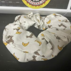 The Cow Jumped Over the Moon Scrunchie is a Scrunchie with cows and moons on it. Read more: https://www.stevesews.com/product/cow-jumped-over-the-moon-scrunchie/