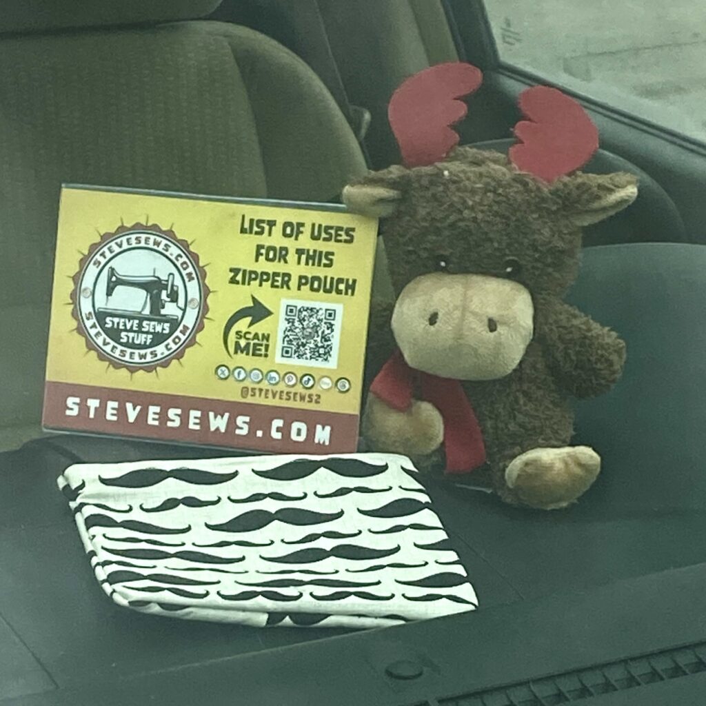 Meet Noella, Christmas seasonal worker. She’s showing off this Mustache Zipper Pouch. She is a reindeer. 