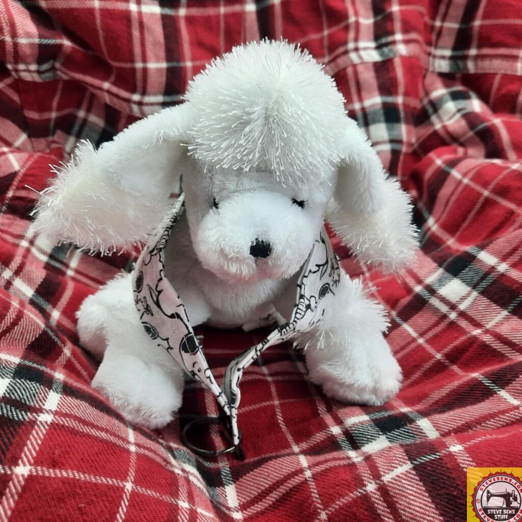 PEP the Puddle was one of my mom’s Webkinz stuffed Lovees. She will now be with us. PEP is for my mom’s initials. She is showing off a Snoopy Keychain lanyard. 
#Snoopy #puddle #webkinz 
SteveSews.com/?s=snoopy 

Thank you to my wife @ponder_with_hjp for taking this photo.